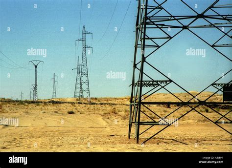 Electric Pylone Lines In The Desert Algeria Stock Photo Alamy