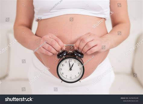Pregnant Woman Naked Belly Holds Alarm Stock Photo 2225670149 Shutterstock