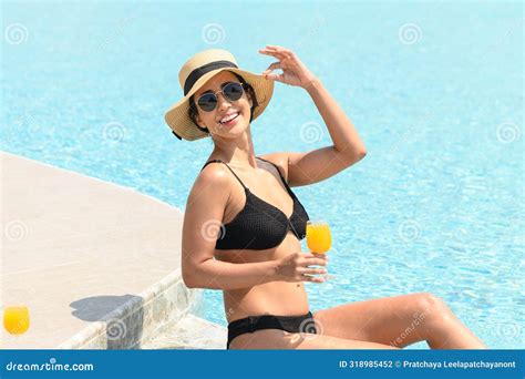 Happy Smiling Woman In Bikini With Straw Hat Relaxing With Orange Juice