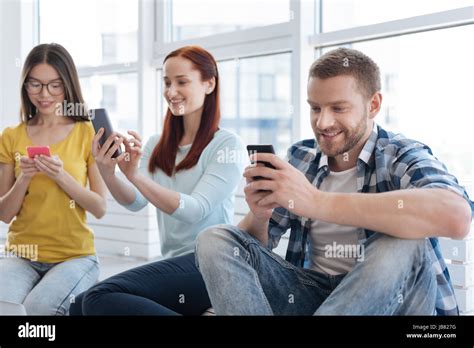 Nice Young People Using Their Smartphones Stock Photo Alamy