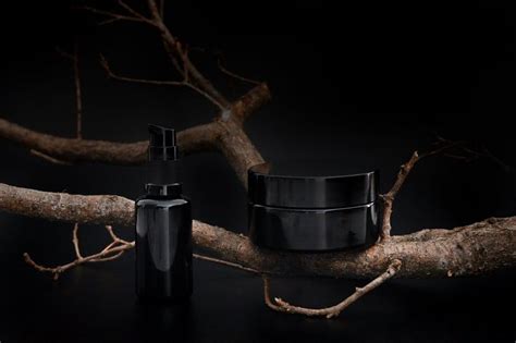 Black Unbranded Cosmetic Cream Jar And Serum With Tree Branch