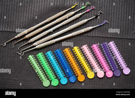 Colorful Orthodontic Ligatures And Stainless Steel Instruments For