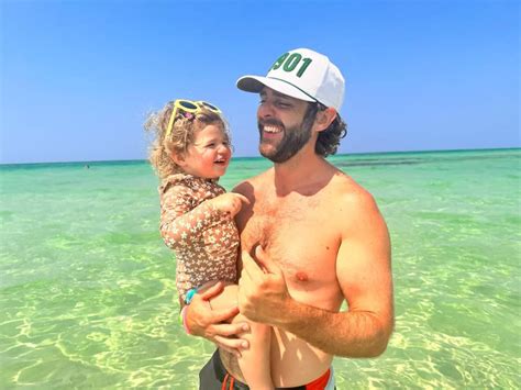 Shirtless Thomas Rhett Soaks Up Beach Time With His Wife And Daughter