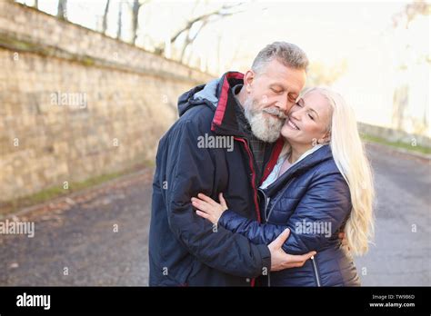 Happy Mature Couple Hugging Outdoors Stock Photo Alamy