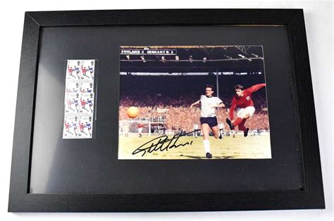 Sir Geoff Hurst A Signed Colour Photograph Of Him Scoring In