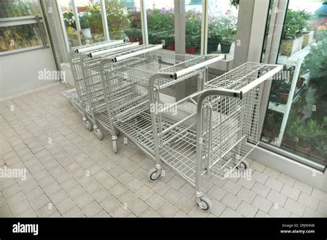 Many Empty Metal Shopping Carts In Garden Center Stock Photo Alamy