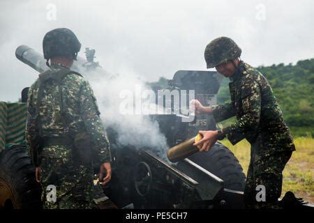 Armed Forces Of The Philippines Marines Fire An M101 105 Mm Howitzer