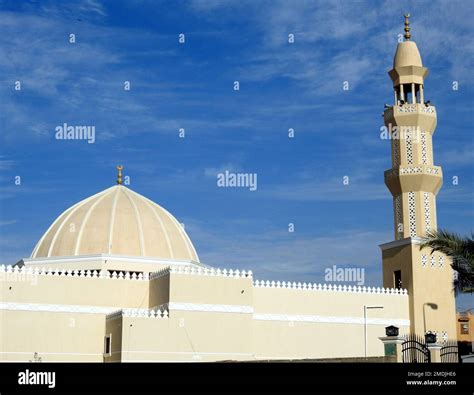 Dome And Minaret Of A Mosque Against A Lovely Blue Sky With Clouds At