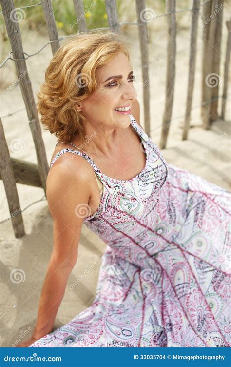 Portrait Of A Beautiful Older Woman Smiling Outdoors Stock Images