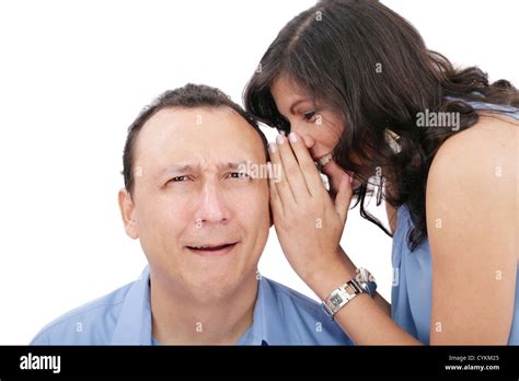 Beautiful Brunette Woman Whispering Into Her Boyfriends Ear Stock Photo