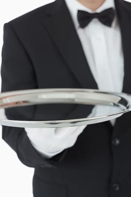 Premium Photo Waiter Holding Silver Tray