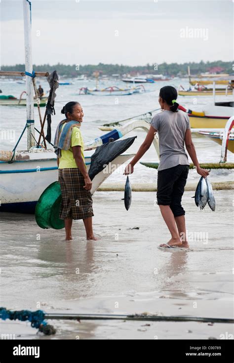 Fishermen On The Balinese Island Of Nusa Lembongan Return To Shore To