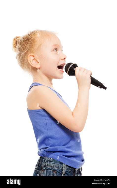 Portrait of small girl singing in microphone Stock Photo - Alamy