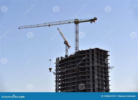 Tower Crane Lifting Concrete Bucket For Pouring Concrete During