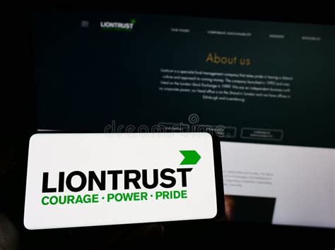 Person Holding Mobile Phone With Logo Of British Company Liontrust