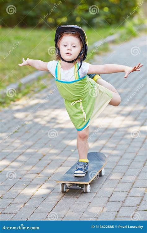 Little Girl Rides Skateboard On One Leg Doing Stock Image Image Of