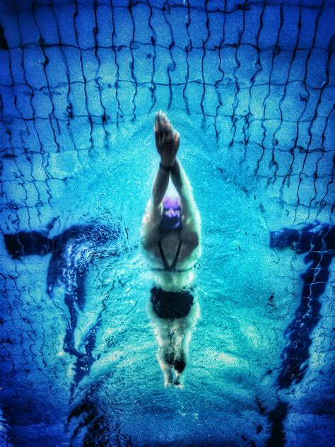 Man Swimming on Pool during Night Time · Free Stock Photo