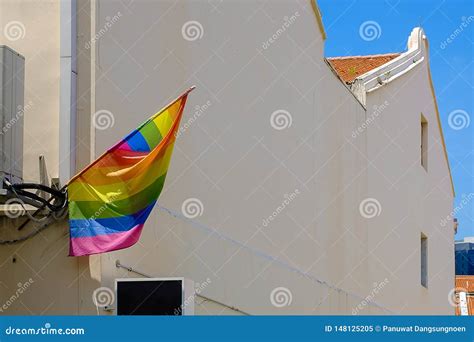 Lgbtq Flag Flying From A House For Lesbian Gay Bisexual Transgender And Community Stock Image