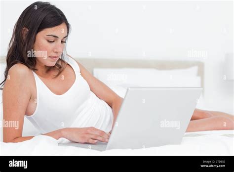 Brunette Using Her Laptop Stock Photo Alamy