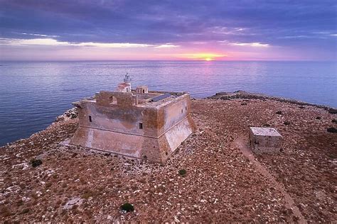 Capo Passero Island At Sunrise With The Light House