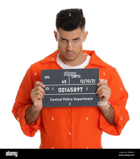 Mug Shot Of Prisoner In Orange Jumpsuit With Board On White Background