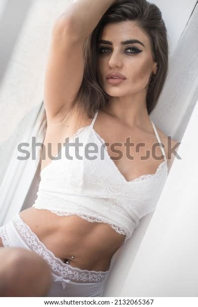 Attractive Sexy Brunette White Lingerie Denim Stock Photo