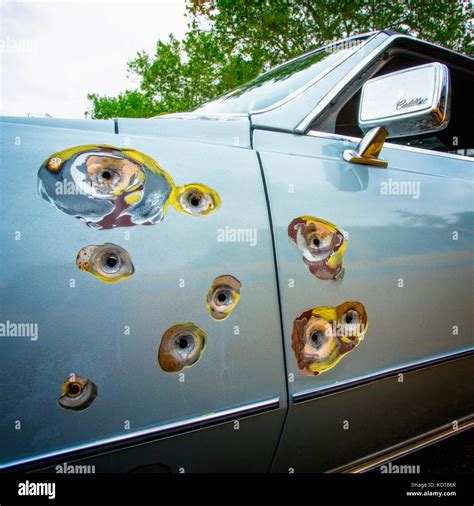 Bullet Holes In A Cadillac Car Fender Stock Photo Alamy