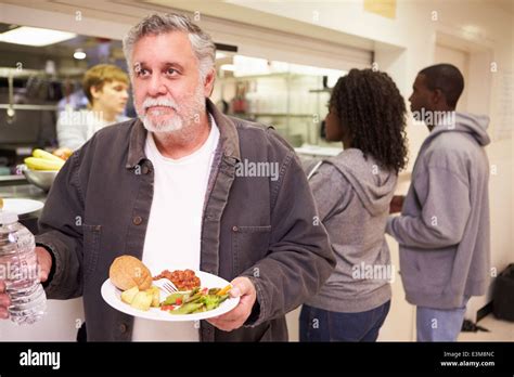 Kitchen Serving Food In Homeless Shelter Stock Photo Alamy