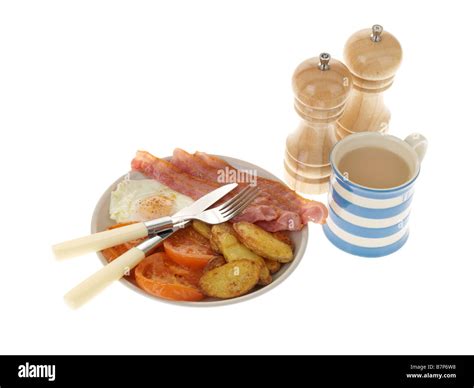 Cooked Breakfast With Streaky Bacon And Egg Stock Photo Alamy