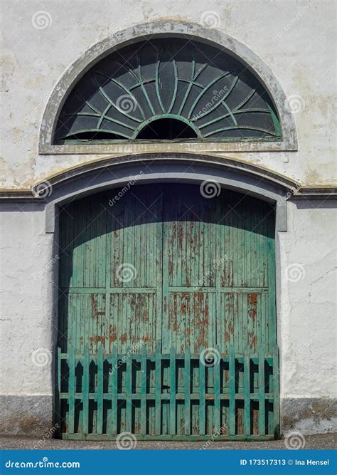 Vintage Green Door and Round Window in an Old Spanish House Stock Image