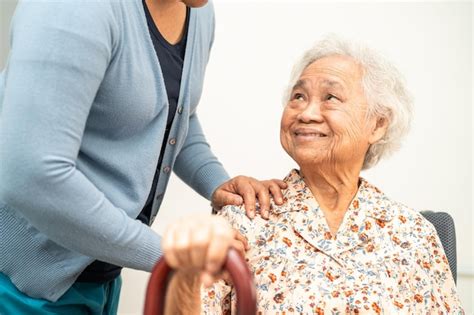 Premium Photo Caregiver Help Asian Elderly Woman Patient With Love