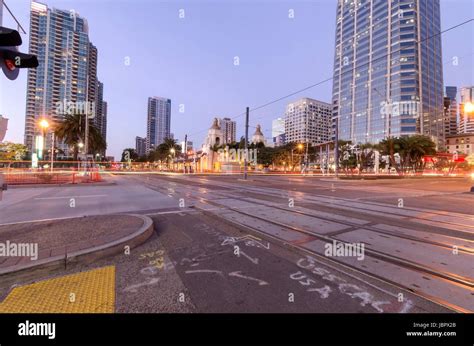 A street view of Downtown San Diego, California, USA, at dusk. A night ...
