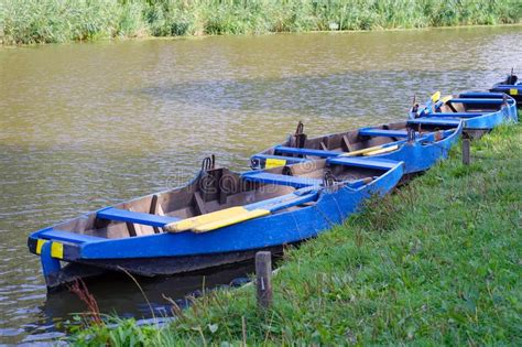 A Row Of Boats By The River In The Morning Stock Image Image Of