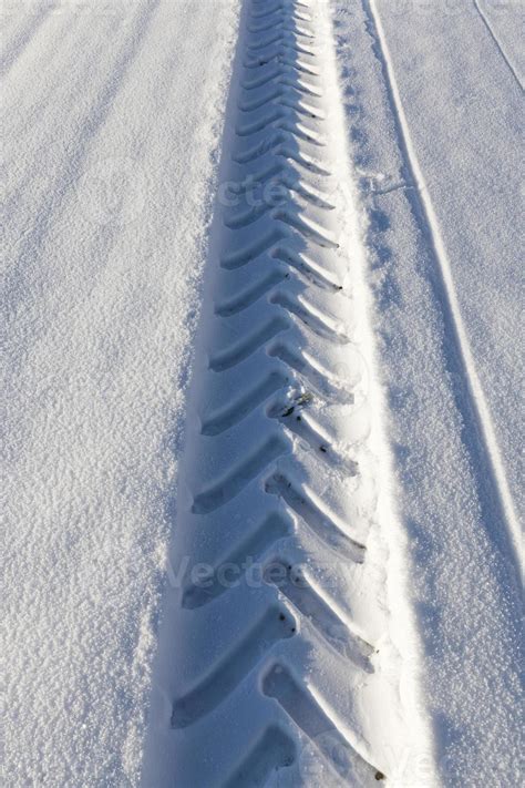 Tire tracks on snow 9446615 Stock Photo at Vecteezy