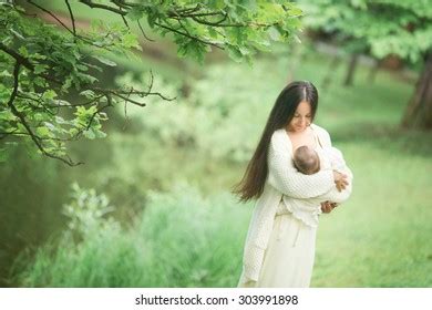 Long Haired Brunette Holding Her Baby Outside Images Stock Photos D Objects Vectors