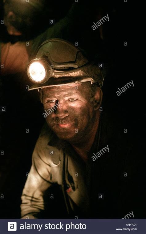 Download This Stock Image Underground Coal Mining Miner On The Coal