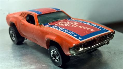 Orange Hot Wheels Toy Car With Red And Blue Decal