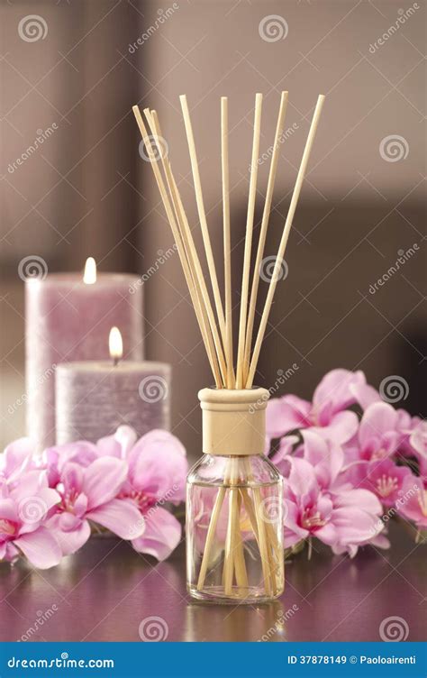 Air Freshener Sticks At Home With Flowers And Ou Of Focus Background