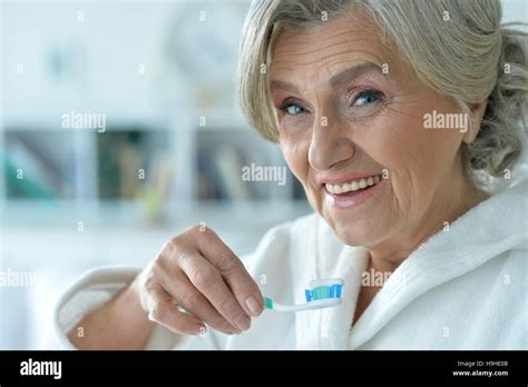 Senior Woman Brushing Her Teeth Stock Photo Alamy