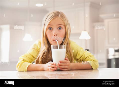 Blonde Girl 6 7 Drinking Milk Stock Photo Alamy