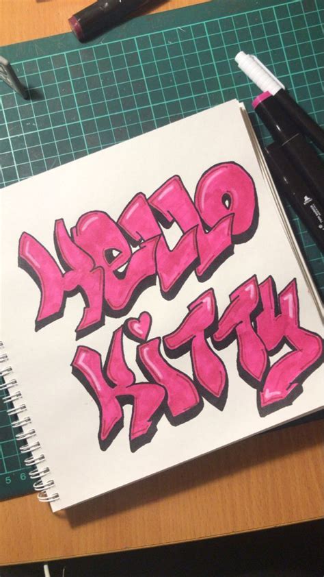 A Notebook With Graffiti Written On It Next To Some Markers And Pens In