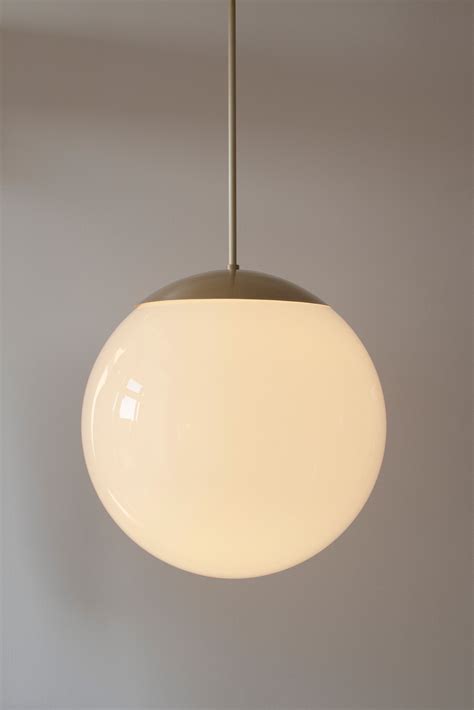 Schwung Dries Brass And Glass Pendant Light Luminesy