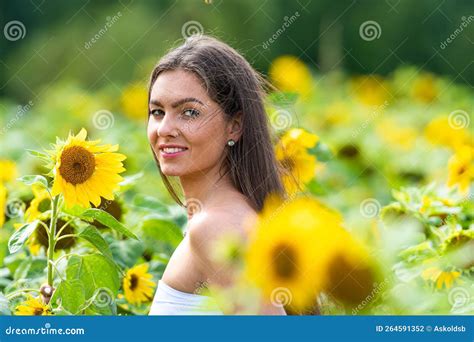 Beautiful Girl In A Sunflower Field Woman With Sunflowers Yellow