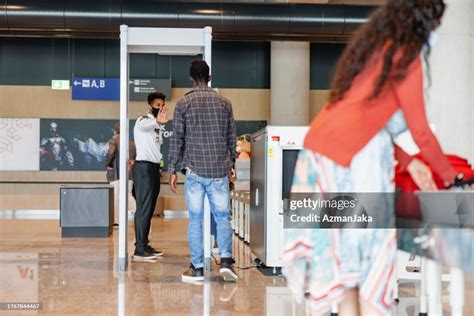 Young African Male Going Through Airport Security High-Res Stock Photo - Getty Images