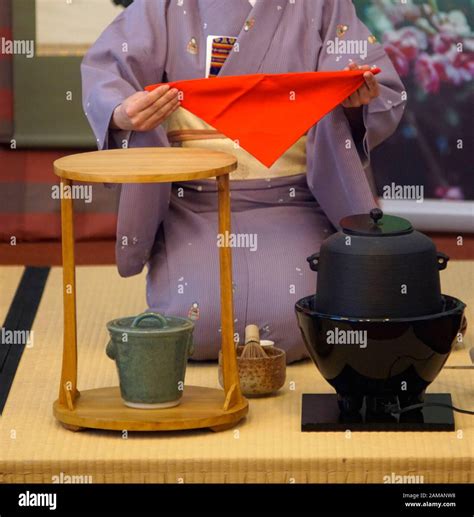 Japanese tea ceremony Chanoyu. Woman dressed in traditional kimono uses ...