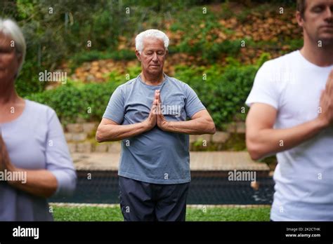 Deeply Connected To His Spirituality Shot Of A Senior Man Meditating