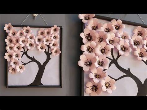 Two Pictures With Pink Flowers On Them Hanging From The Wall Next To