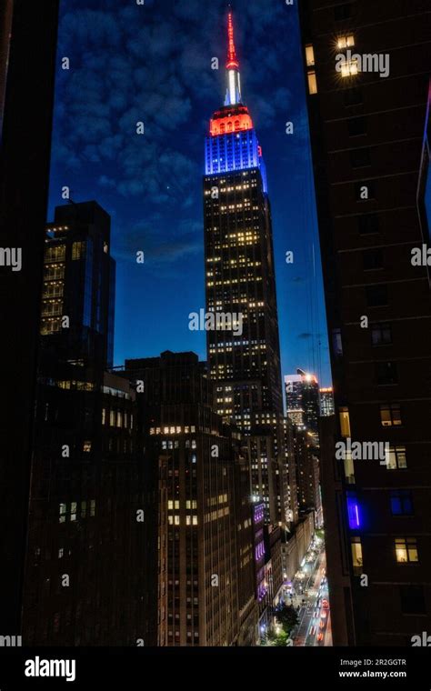 The Empire State Building Is Brightly Lit On An Early Spring Evening