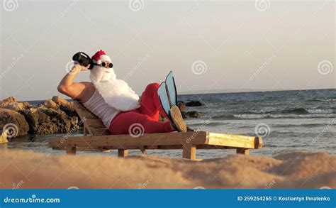 Santa Claus Sunbathes. Funny Santa Claus, in Sunglasses and Flippers ...