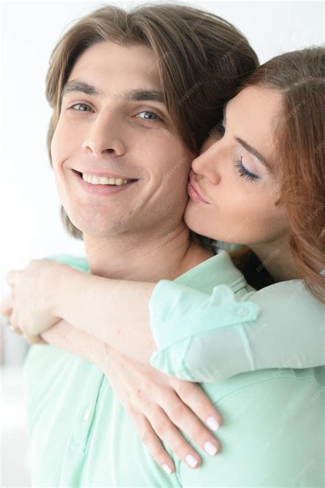 Premium Photo Portrait Of A Beautiful Young Couple Hugging